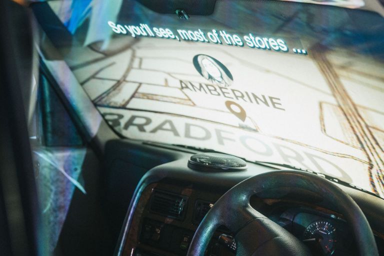 A still from the film Driving Home from the back of a black cab